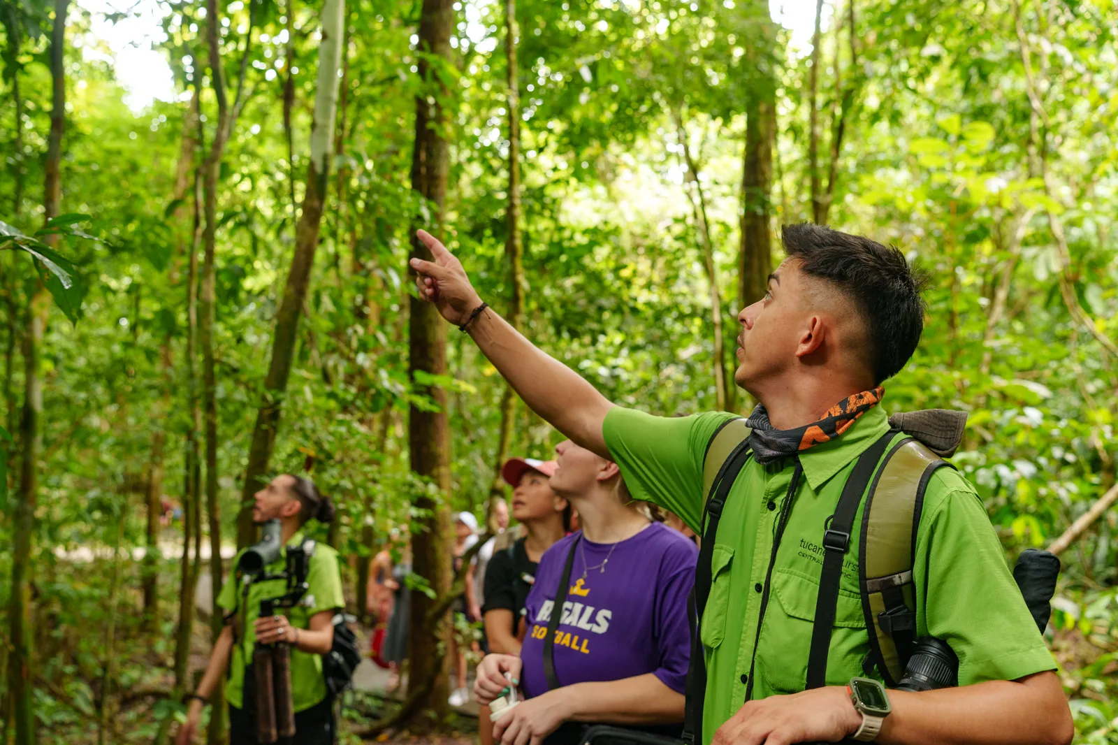 Naturalist guide pointing out wildlife to the group