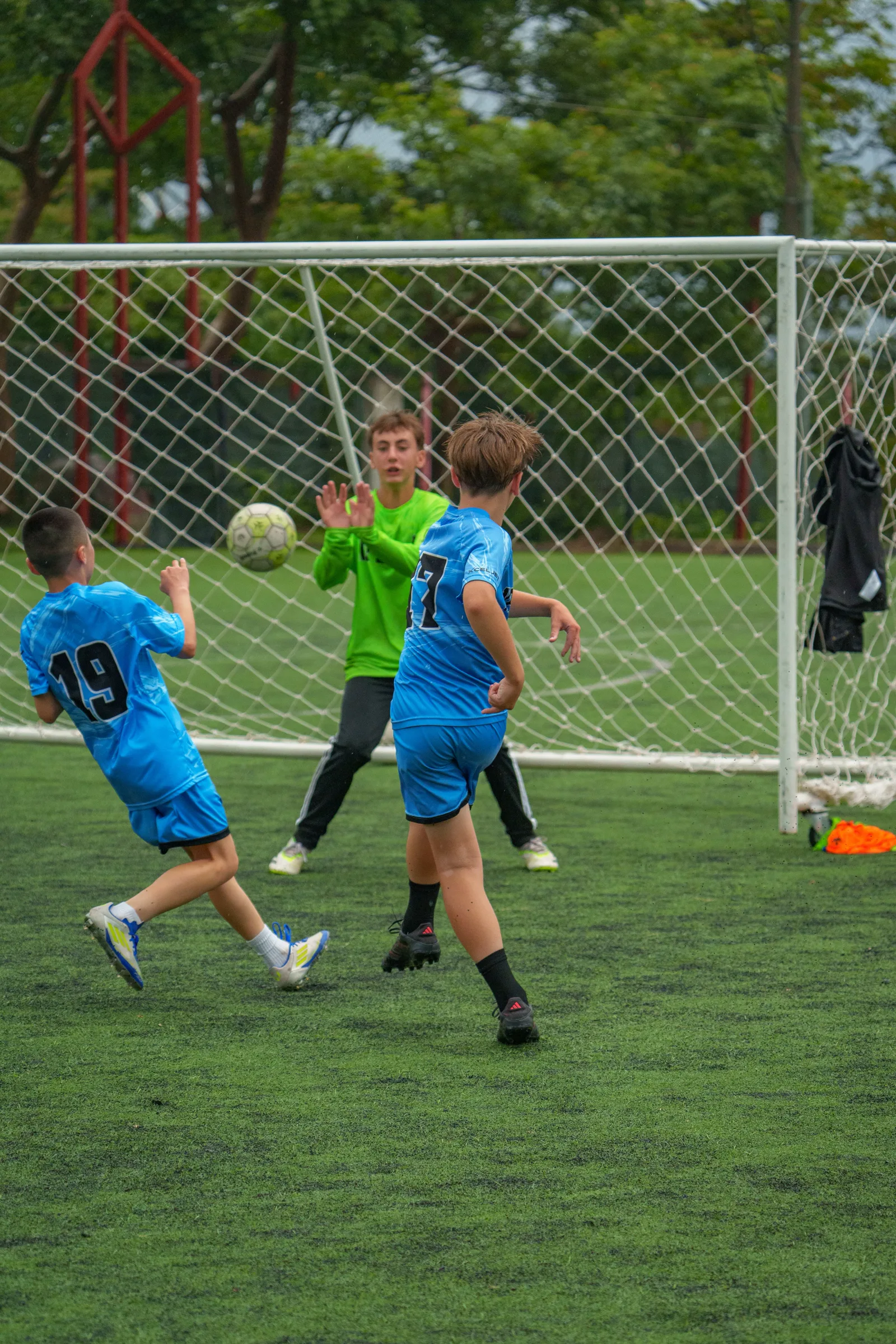 Attacker finishing at goal during a match